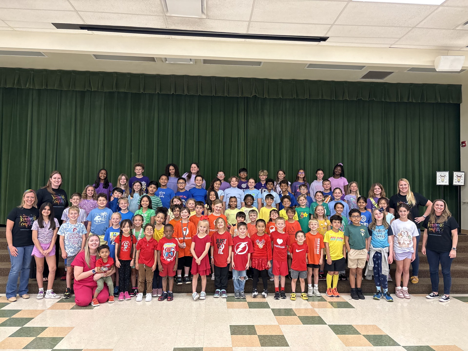 Student Rainbow + Admin - <p>OES is continuing to celebrate our February Kindness Month. We loved seeing our students this week dressed in the colors of the rainbow while our staff members are “throwing kindness around like confetti!”</p>